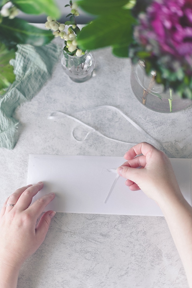 Make wedding table numbers with Cricut window cling and glass bottles